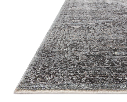 The Sonnet SNN-07 Charcoal / Mist Area Rug is a power-loomed polypropylene and polyester area rug that radiates deep charcoal and soft misty charm and traditional elegance