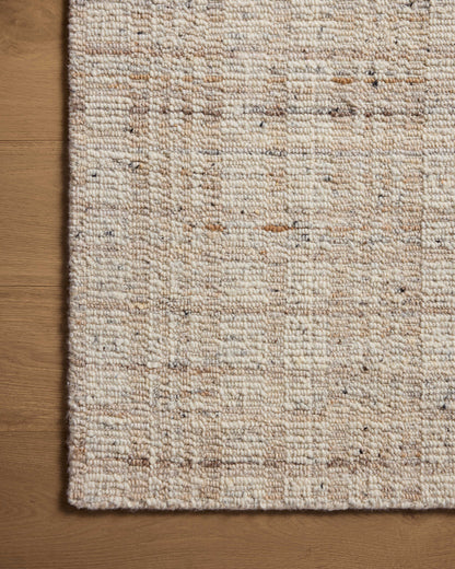 Expertly crafted as a hand-loomed wool area rug with graphic artistry, the Sonya SOY-01 Ivory / Natural Area Rug captures refined ivory and warm natural tones beautifully