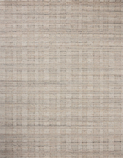 Finished in subtle pebble and misty tones with graphic styling, the Sonya SOY-02 Pebble / Fog Area Rug is a hand-loomed wool area rug for modern living