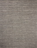 Dressed in striking granite and vibrant multi-toned hues with graphic detail, the Sonya SOY-05 Granite / Multi Area Rug is a hand-loomed wool area rug that completes any room