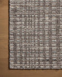 Dressed in striking granite and vibrant multi-toned hues with graphic detail, the Sonya SOY-05 Granite / Multi Area Rug is a hand-loomed wool area rug that completes any room