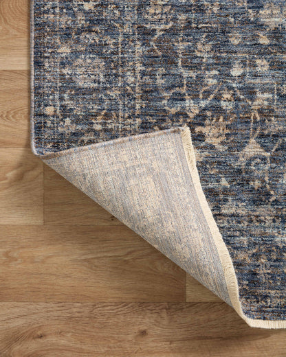 The Sorrento SOR-01 Midnight / Natural Area Rug pairs dramatic midnight and warm natural tones and vintage patterns in a power-loomed 100% polyester area rug