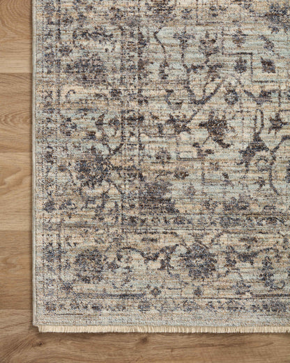 Crafted as a power-loomed 100% polyester area rug, the Sorrento SOR-01 Mist / Charcoal Area Rug brings soft misty and deep charcoal warmth and vintage character to your space