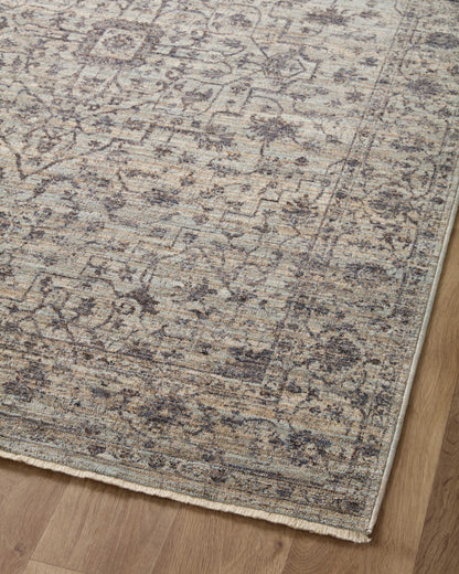 Crafted as a power-loomed 100% polyester area rug, the Sorrento SOR-01 Mist / Charcoal Area Rug brings soft misty and deep charcoal warmth and vintage character to your space