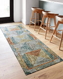 A hooked wool area rug featuring geometric and eclectic design and tranquil lagoon and spirited spice tones, the Spectrum SPE-01 Lagoon / Spice Area Rug adds character to any room