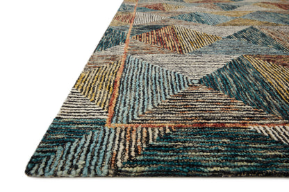 A hooked wool area rug featuring geometric and eclectic design and tranquil lagoon and spirited spice tones, the Spectrum SPE-01 Lagoon / Spice Area Rug adds character to any room