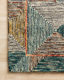 A hooked wool area rug featuring geometric and eclectic design and tranquil lagoon and spirited spice tones, the Spectrum SPE-01 Lagoon / Spice Area Rug adds character to any room