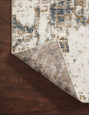 Finished in distinctive pewter and earthy olive tones with abstract styling, the Spirit SPI-01 Pewter / Olive Area Rug is a power-loomed 100% polypropylene area rug for modern living