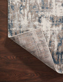 A power-loomed 100% polypropylene area rug with abstract design in grounding stone and calming blue hues, the Spirit SPI-02 Stone / Blue Area Rug is a standout in any décor