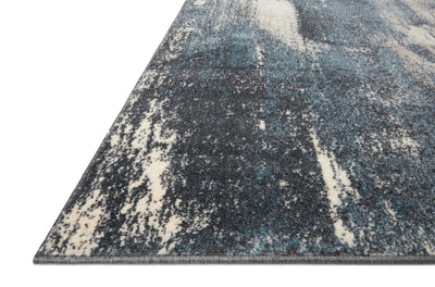 Dressed in deep indigo and refined ivory hues with abstract detail, the Spirit SPI-04 Indigo / Ivory Area Rug is a power-loomed 100% polypropylene area rug that completes any room