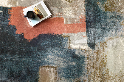 The Spirit SPI-05 Stone / Multi Area Rug transforms any space with grounding stone and vibrant multi-toned tones and abstract design in a power-loomed 100% polypropylene area rug