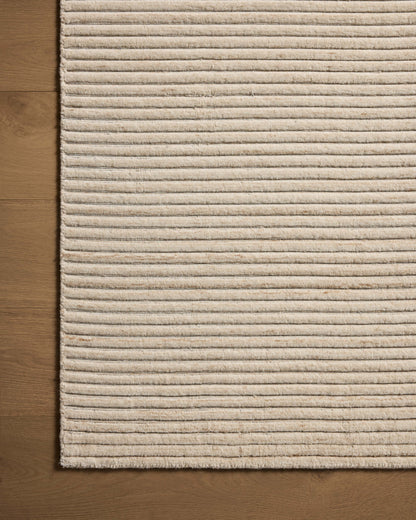 The Sterling STL-01 Ivory Area Rug transforms any space with refined ivory tones in a hand-loomed polyester area rug