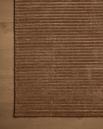 A hand-loomed polyester area rug in luxurious mocha tones, the Sterling STL-01 Mocha Area Rug grounds your room beautifully
