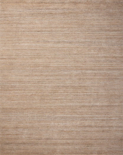 The Sterling STL-01 Natural Area Rug is a hand-loomed polyester area rug that radiates warm natural charm