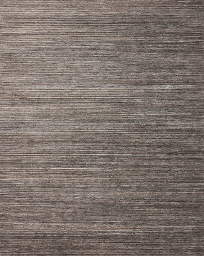 Layered in grounding stone hues, the Sterling STL-01 Stone Area Rug is a hand-loomed polyester area rug perfect for any setting
