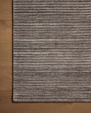 Layered in grounding stone hues, the Sterling STL-01 Stone Area Rug is a hand-loomed polyester area rug perfect for any setting