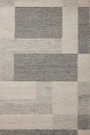 The Stiles STI-01 Dove / Ink Area Rug is a hand-tufted 100% wool area rug that radiates gentle dove and bold ink charm and colorblock and ribbed elegance