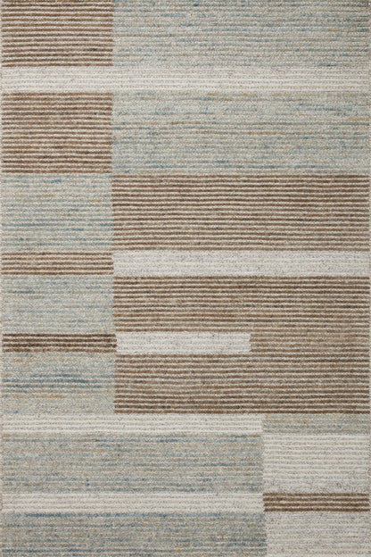 Layered in rich tobacco and tranquil lagoon hues with colorblock and ribbed patterns, the Stiles STI-02 Tobacco / Lagoon Area Rug is a hand-tufted 100% wool area rug perfect for any setting