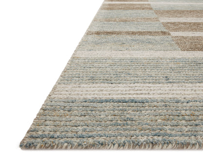 Layered in rich tobacco and tranquil lagoon hues with colorblock and ribbed patterns, the Stiles STI-02 Tobacco / Lagoon Area Rug is a hand-tufted 100% wool area rug perfect for any setting
