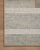 Layered in rich tobacco and tranquil lagoon hues with colorblock and ribbed patterns, the Stiles STI-02 Tobacco / Lagoon Area Rug is a hand-tufted 100% wool area rug perfect for any setting