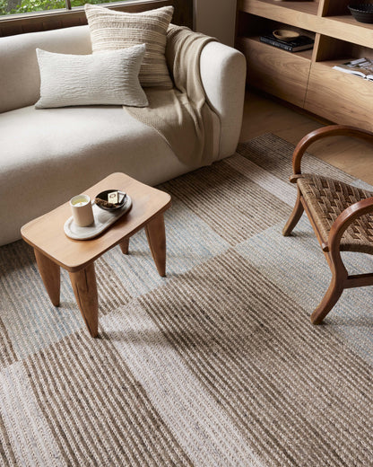 Layered in rich tobacco and tranquil lagoon hues with colorblock and ribbed patterns, the Stiles STI-02 Tobacco / Lagoon Area Rug is a hand-tufted 100% wool area rug perfect for any setting