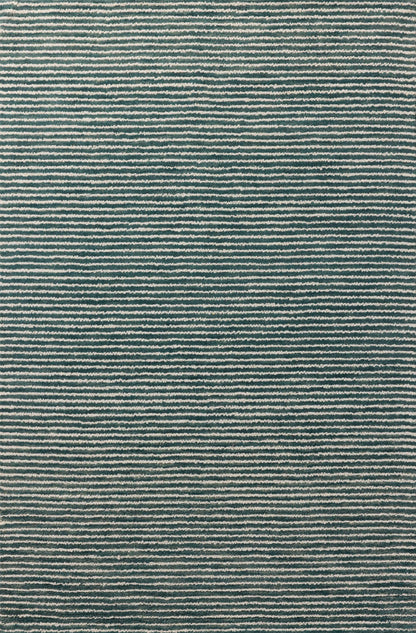 The Sunday SUN-01 Ocean / Ivory Area Rug blends serene ocean and refined ivory tones into a hand-tufted wool area rug with timeless appeal