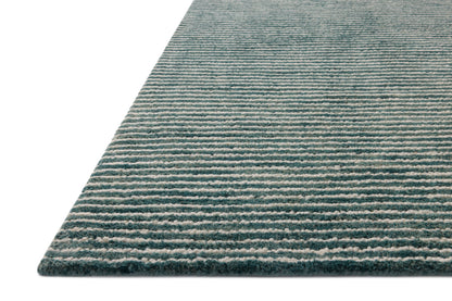 The Sunday SUN-01 Ocean / Ivory Area Rug blends serene ocean and refined ivory tones into a hand-tufted wool area rug with timeless appeal