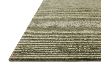 A stunning hand-tufted wool area rug, the Sunday SUN-01 Olive / Ivory Area Rug features earthy olive and refined ivory tones for a polished look