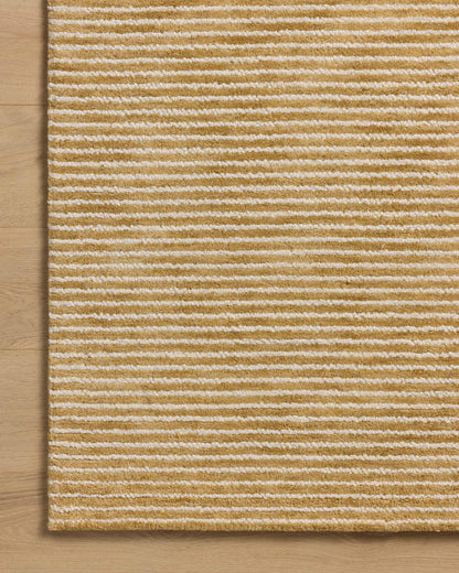 Designed in golden wheat and refined ivory hues, the Sunday SUN-01 Wheat / Ivory Area Rug is a hand-tufted wool area rug that stands out