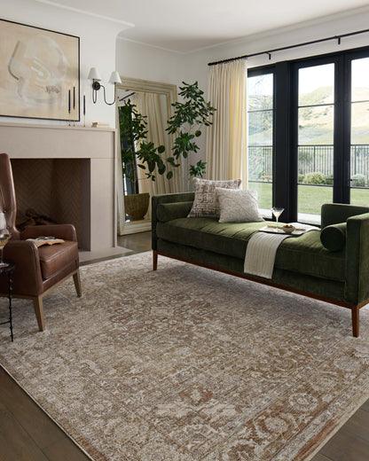 Featuring warm natural and earthy clay hues and traditional detail, the Tabitha TAI-01 Natural / Clay Area Rug is a power-loomed polyester area rug for any room