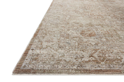 Featuring warm natural and earthy clay hues and traditional detail, the Tabitha TAI-01 Natural / Clay Area Rug is a power-loomed polyester area rug for any room