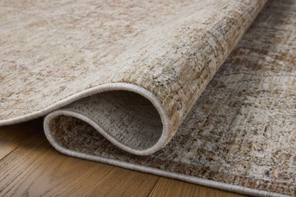 Featuring warm natural and earthy clay hues and traditional detail, the Tabitha TAI-01 Natural / Clay Area Rug is a power-loomed polyester area rug for any room