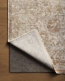 Featuring warm natural and earthy clay hues and traditional detail, the Tabitha TAI-01 Natural / Clay Area Rug is a power-loomed polyester area rug for any room