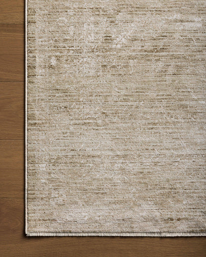 A power-loomed polyester area rug with traditional flair in calming sage and refined ivory tones, the Tabitha TAI-02 Sage / Ivory Area Rug anchors any room