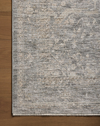 The Tabitha TAI-02 Stone / Natural Area Rug pairs grounding stone and warm natural tones and traditional patterns in a power-loomed polyester area rug