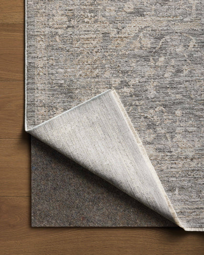 The Tabitha TAI-02 Stone / Natural Area Rug pairs grounding stone and warm natural tones and traditional patterns in a power-loomed polyester area rug