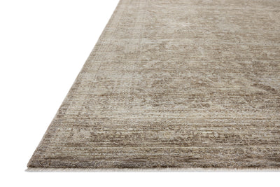 Crafted as a power-loomed polyester area rug, the Tabitha TAI-02 Taupe / Pebble Area Rug brings versatile taupe and subtle pebble warmth and traditional character to your space
