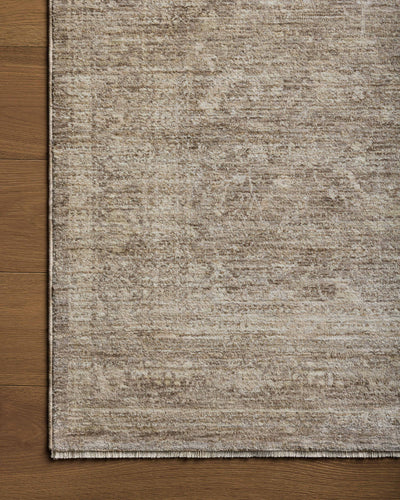 Crafted as a power-loomed polyester area rug, the Tabitha TAI-02 Taupe / Pebble Area Rug brings versatile taupe and subtle pebble warmth and traditional character to your space