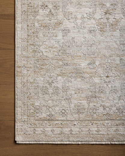 With refined ivory and khaki hues and traditional styling, the Tabitha TAI-03 Ivory / Khaki Area Rug is a power-loomed polyester area rug that elevates any room