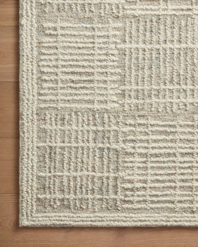 A hand-tufted 100% wool area rug with abstract and linear flair in soft misty and refined ivory tones, the Tallulah TLL-02 Mist / Ivory Area Rug anchors any room
