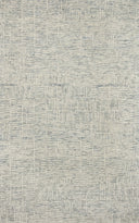The Tallulah TLL-03 Sky / Ivory Area Rug pairs breezy sky-blue and refined ivory tones and abstract and linear patterns in a hand-tufted 100% wool area rug