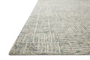 The Tallulah TLL-03 Sky / Ivory Area Rug pairs breezy sky-blue and refined ivory tones and abstract and linear patterns in a hand-tufted 100% wool area rug