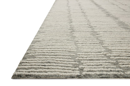 Crafted as a hand-tufted 100% wool area rug, the Tallulah TLL-04 Stone / Ivory Area Rug brings grounding stone and refined ivory warmth and abstract and linear character to your space