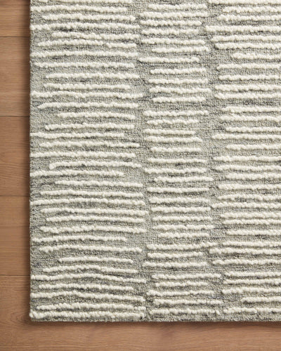 Crafted as a hand-tufted 100% wool area rug, the Tallulah TLL-04 Stone / Ivory Area Rug brings grounding stone and refined ivory warmth and abstract and linear character to your space