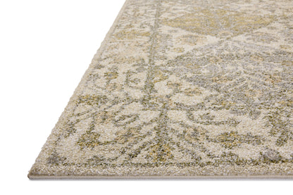 With warm beige and vibrant multi-toned hues, the Tamryn TAM-01 Beige / Multi Area Rug is a power-loomed 100% polypropylene area rug that elevates any room