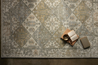 With warm beige and vibrant multi-toned hues, the Tamryn TAM-01 Beige / Multi Area Rug is a power-loomed 100% polypropylene area rug that elevates any room
