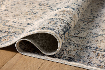 A power-loomed polypropylene and polyester area rug featuring contemporary design and warm natural and light grey tones, the Teagan TEA-01 Natural / Lt. Grey Area Rug adds character to any room