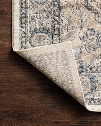 A power-loomed polypropylene and polyester area rug featuring contemporary design and warm natural and light grey tones, the Teagan TEA-01 Natural / Lt. Grey Area Rug adds character to any room
