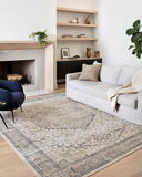 A power-loomed polypropylene and polyester area rug featuring contemporary design and warm natural and light grey tones, the Teagan TEA-01 Natural / Lt. Grey Area Rug adds character to any room