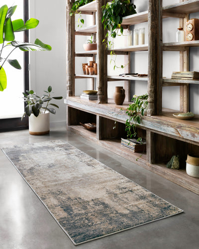 Dressed in refined ivory and soft misty hues with contemporary detail, the Teagan TEA-08 Ivory / Mist Area Rug is a power-loomed polypropylene and polyester area rug that completes any room